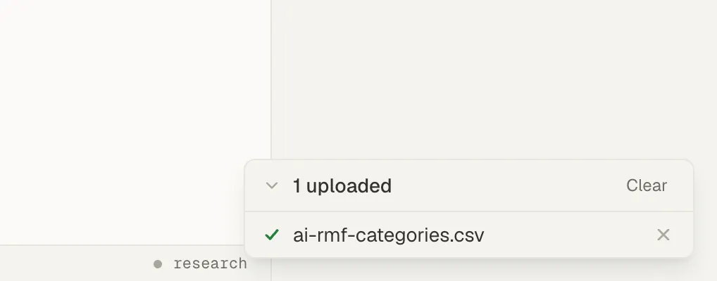 The upload panel in the bottom-right corner, listing one uploaded CSV file